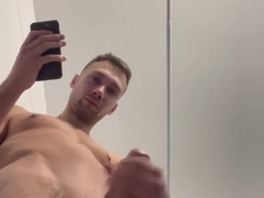 Amateur young fellow faps his huge spear in the douche and jizzes right on camera