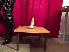Slave slut rides huge dildo in crotch boots