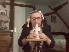 Suck a dildo in school attire with a pink pleated skirt