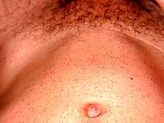 Skinny twink stroking his dick and showing abs
