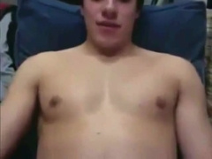 Straight hockey player giving a webcam show with team friends looking on