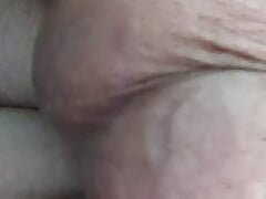 Horny in bed busting a nut.
