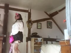 In black pleated mini skirt and white blouse