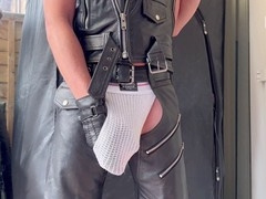 Man in leather glove jerks off big cock solo