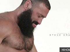 Tattooed gays with beard eats cock