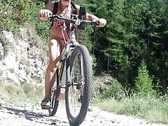 stretching the nipples naked on a byke ride