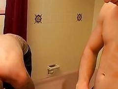 Inked jocks jerk off big cocks in shower