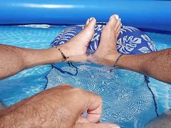 Showing off my wet feet in the pool