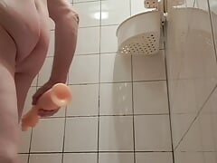 Transparent very long dildo in shower