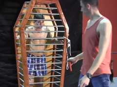 Caged boy is eager to experience his first maledom experience