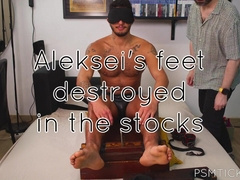 PSMTickling - Tied in Stocks—Aleksei’s Ticklish Soles Get No Mercy