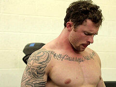 tattooed hunk fucking this skinny guy in the booty at the gym