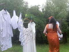 In orange dress with laundry pickup