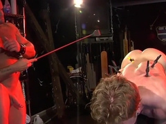 Clamped male slave lets horny master do whatever he likes