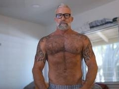 Hairy mature DILF cums inside black hunk's ass after raw anal