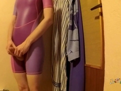 young boy in tight short swimsuit showing closer