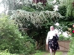 Dressed with a black midi skirt with flowers for a night out