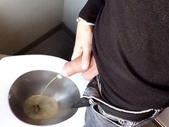 Piss with low hanging balls on the train toilet