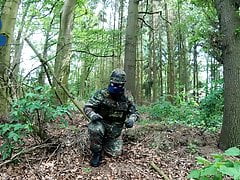 Soldier pup pawing off in the woods