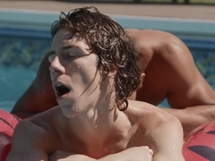 Twink tracing patterns on a hard cock in a swimming pool