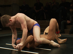 Muscular lovers strip naked to fuck during their wrestling fetish
