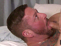 tattooed stud pleasured by pal