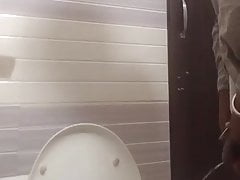 Urinating and shaking penis