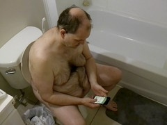 Hunky gay man shaves his pubes, cock, and balls to perfection