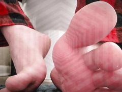 Obedient slave training licks feet and