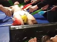 Restrained amateur laughs during foot and body tickling