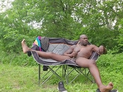 Tormentor Sir Maxximus strokes his massive black cock in the woods