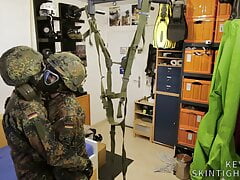 Two soldiers in German Flecktarn in gas masks wanking