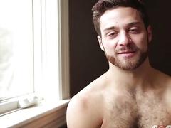 A beautiful blonde hunk is screwed from behind by a fat dick
