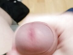 Guy jerking off uncircumcised cock on the table