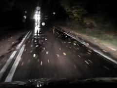 Nude camper rail at night. Jacking in the rain on the road in the city.