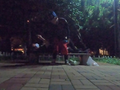 Fellow in black silk tempts passers-by on the side of the road for sucky-sucky bang-out