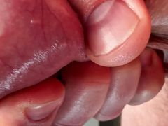 Close-up testicles massaging until big cumshot