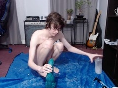 Twink's backdoor stretched wide, leaking cum