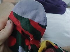 Having fun with wifes socks with cumshot