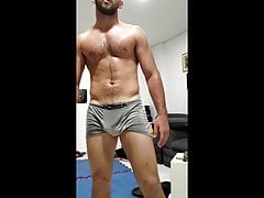 Musky alpha male dripping sweat post workout - fit muscle