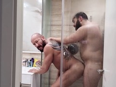 Hunks having fun in the bathroom while spinning and peeing