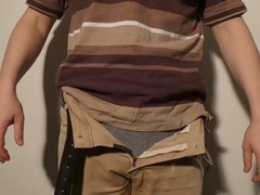 Close up of man undressing and pleasuring his uncut cock until fully erect