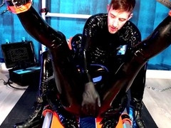 Alpha dom uses a fucking machine on his gay slave in a latex dungeon