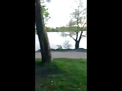 A naked guy walks in the park in public