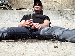 Pissing all over myself in a drainage ditch