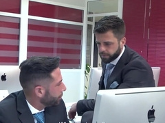 Office hunk taking care of his prey in front of the computer